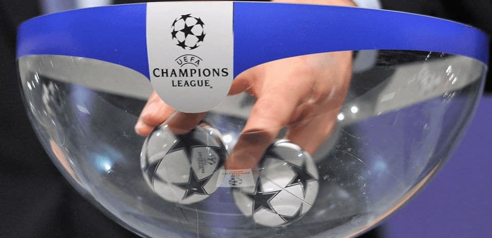 Hand reaching into bowl for Champions League draw