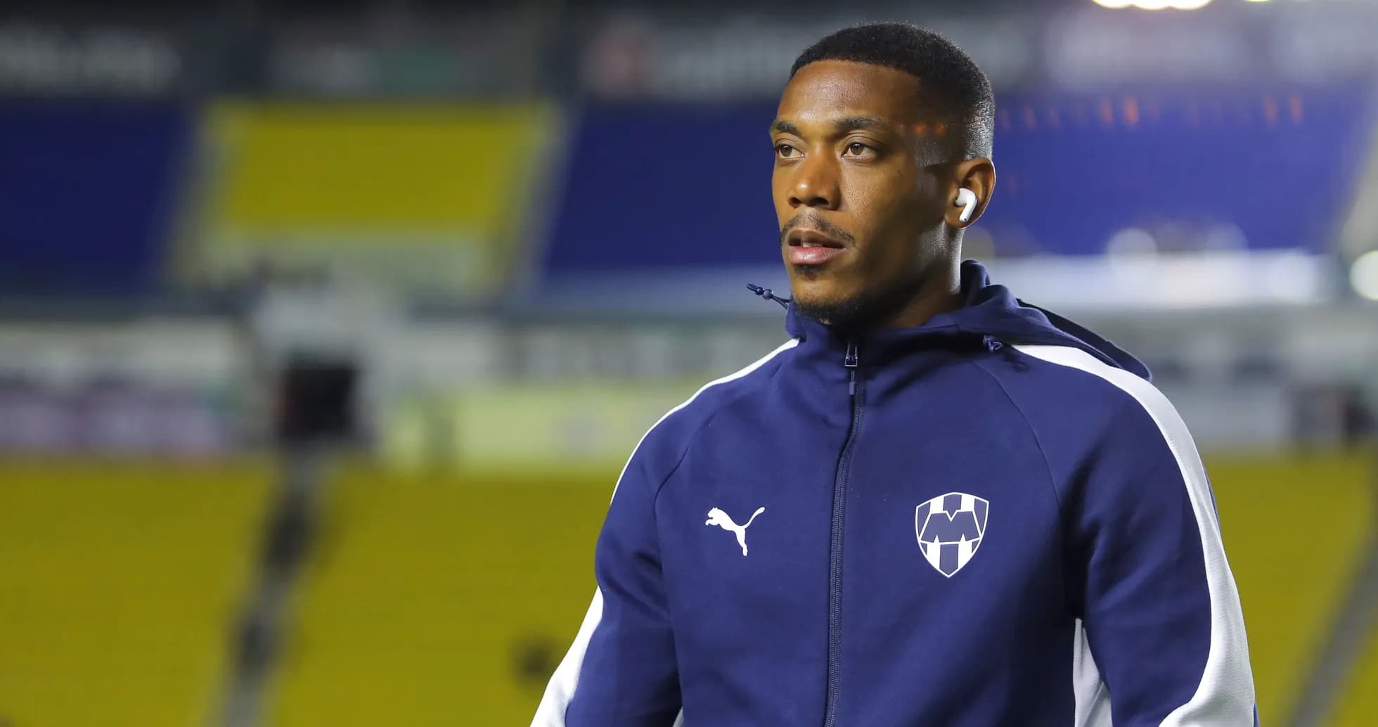 Player wearing team tracksuit before match