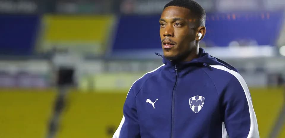 Player wearing team tracksuit before match