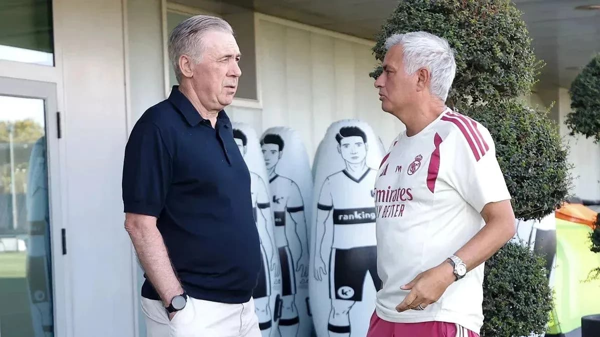 Two coaches discussing near training equipment