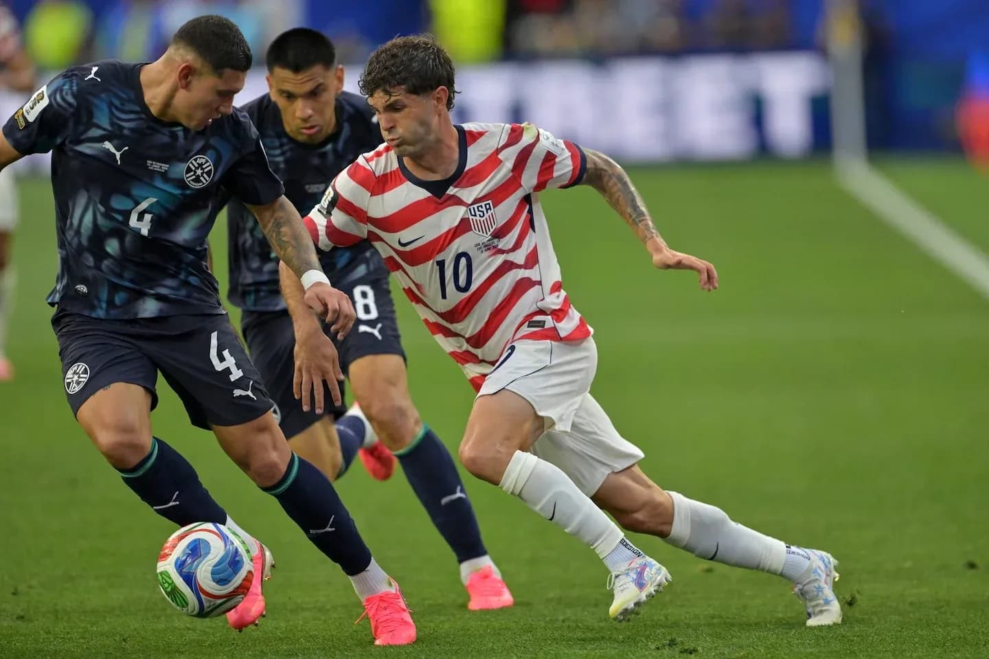 Player dribbling past defender during soccer match
