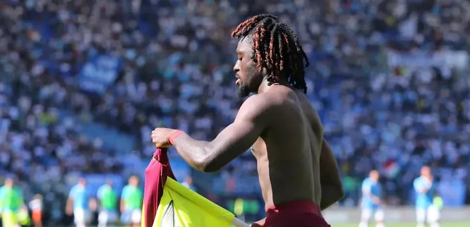 Player removing jersey during match on field