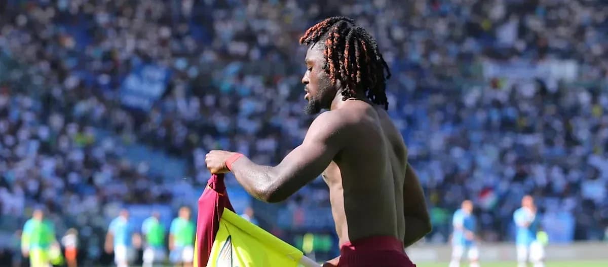 Player removing jersey during match on field