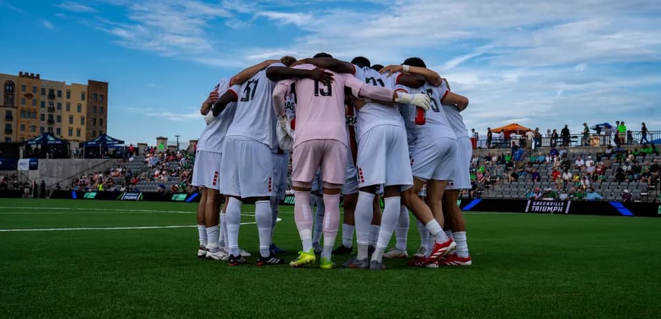 Greenville Triumph players in huddle before match