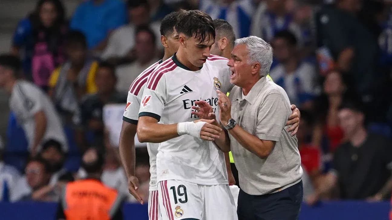 Coach speaking to player during match on sideline