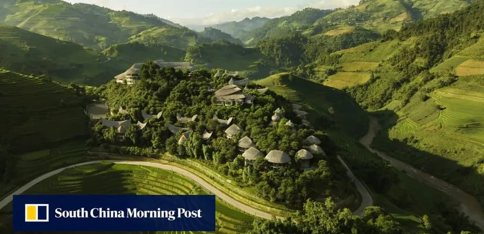 Aerial view of hillside village surrounded by rice terraces