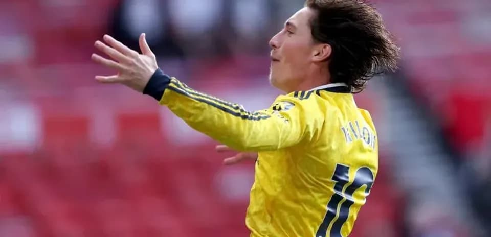 Player celebrating in yellow jersey during match