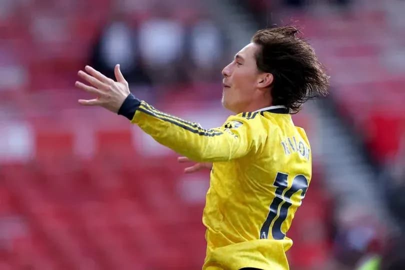 Player celebrating in yellow jersey during match
