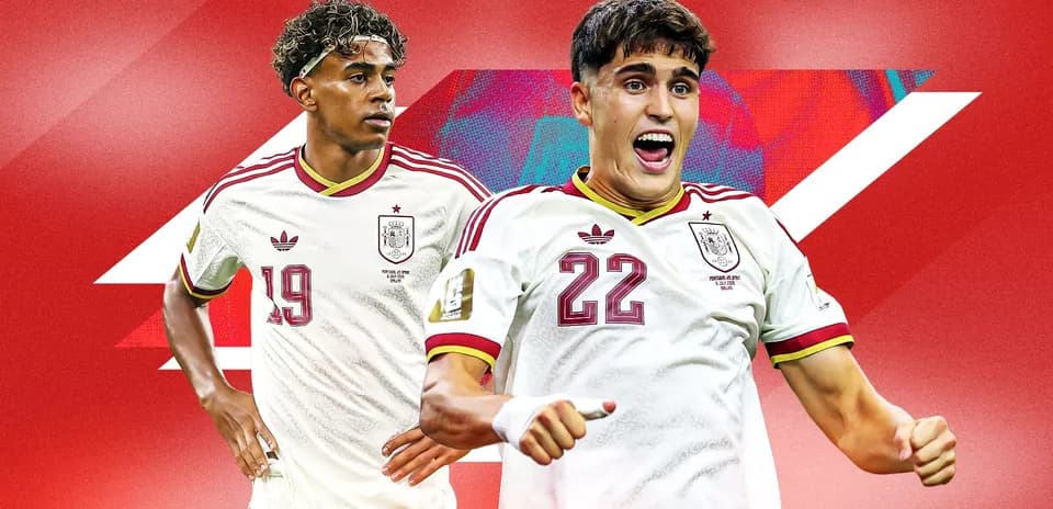 Two Spain players celebrating on red background