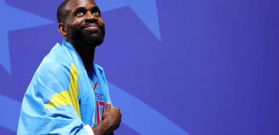 Athlete wearing national flag during event ceremony