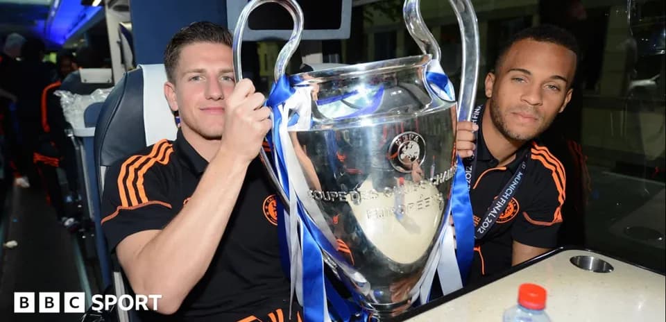 Players celebrating with UEFA Champions League trophy