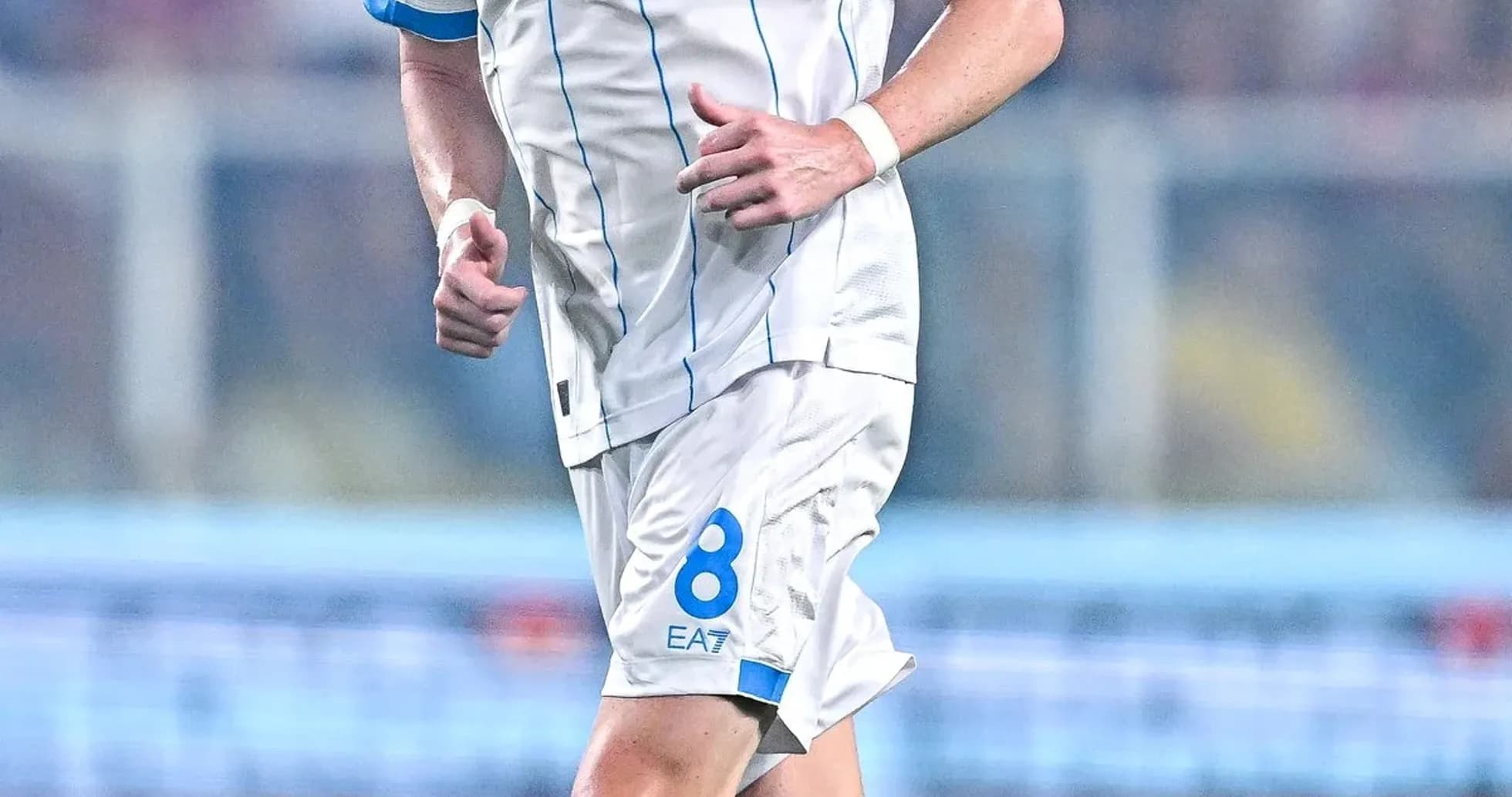 Player in Napoli kit running on the field