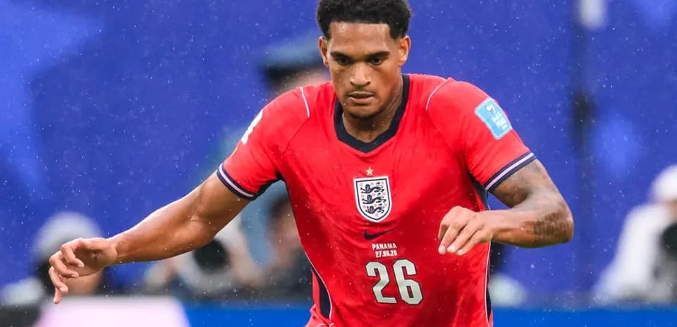 Player running in England's red kit during match