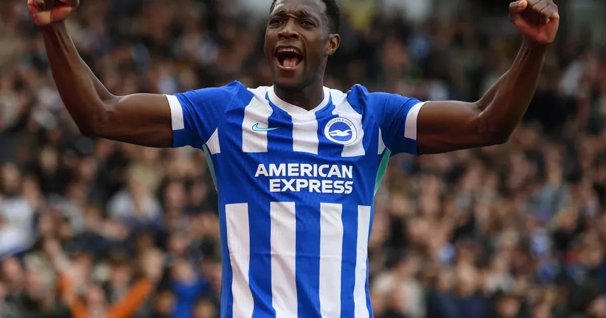 Player celebrating a goal wearing Brighton kit