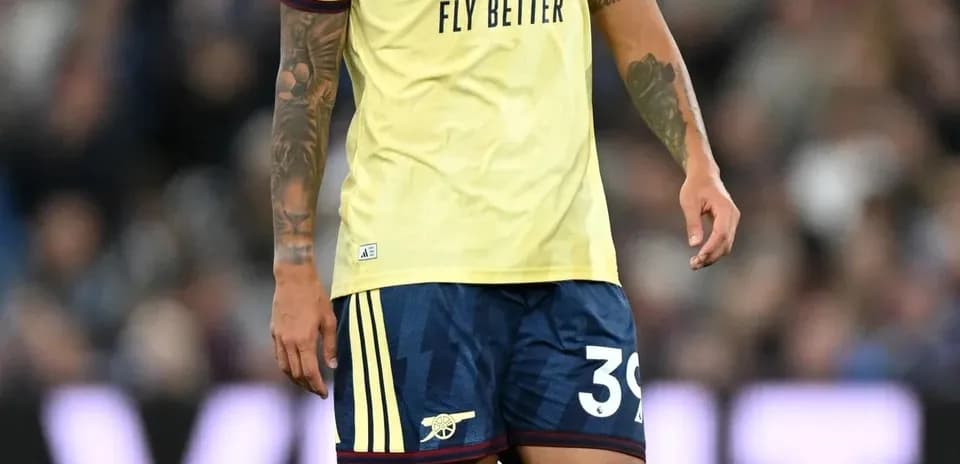 Player wearing Arsenal kit during match on field