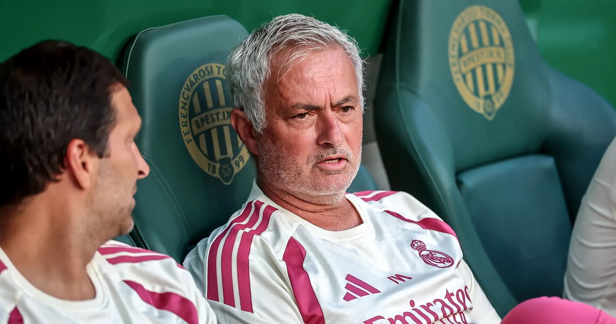Manager discussing strategies on the bench