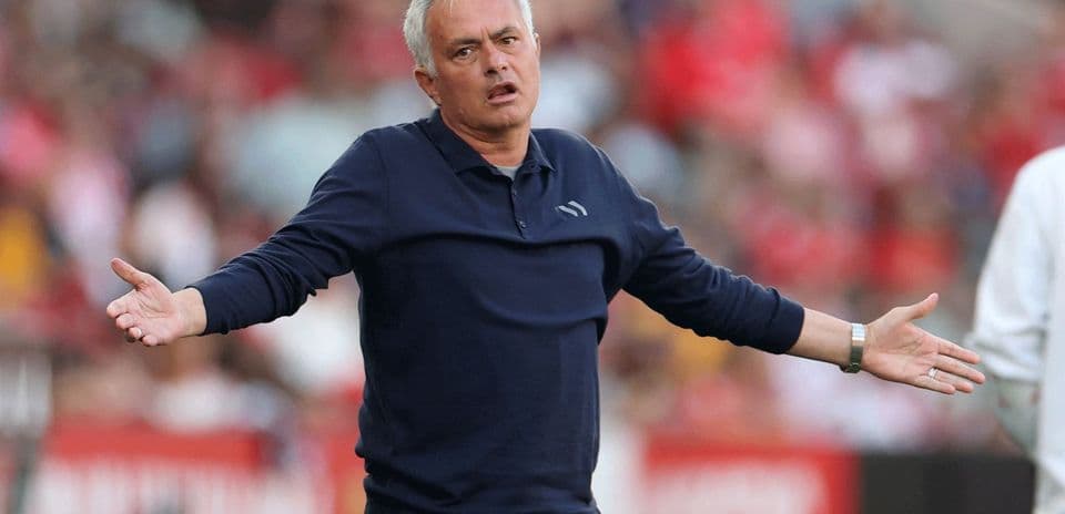 Manager gesturing on the sideline during match