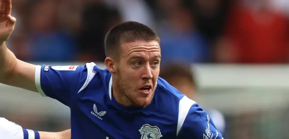 Player running during a football match for Cardiff City