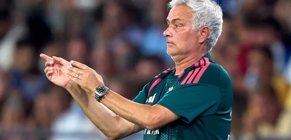 Manager directing players during a match