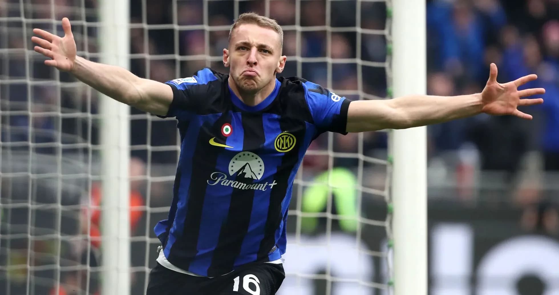Player celebrating a goal in front of the net