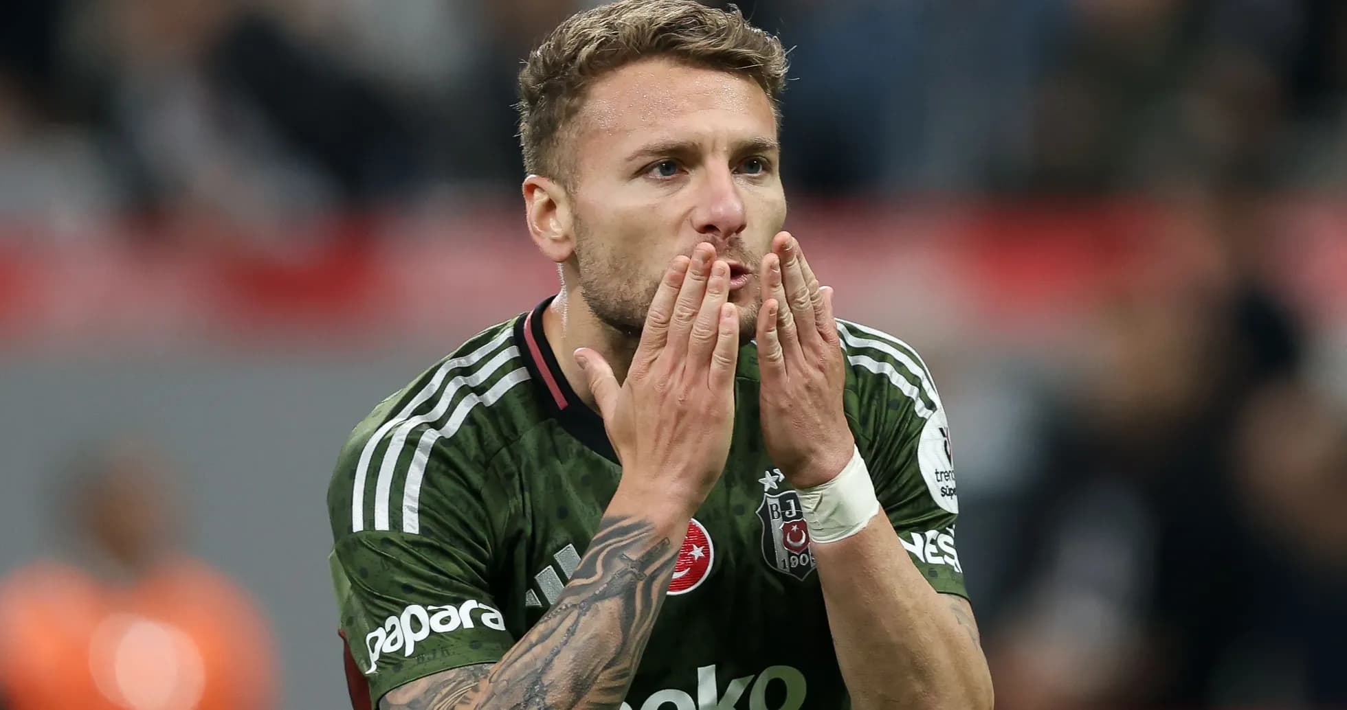 Player blowing kisses to fans during match