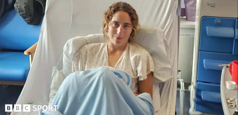 Athlete resting in hospital bed wearing gown