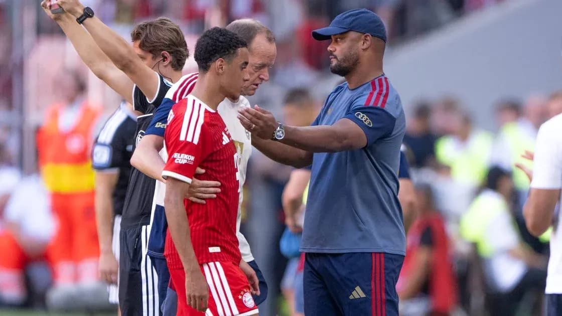 Player receiving guidance from coach during substitution