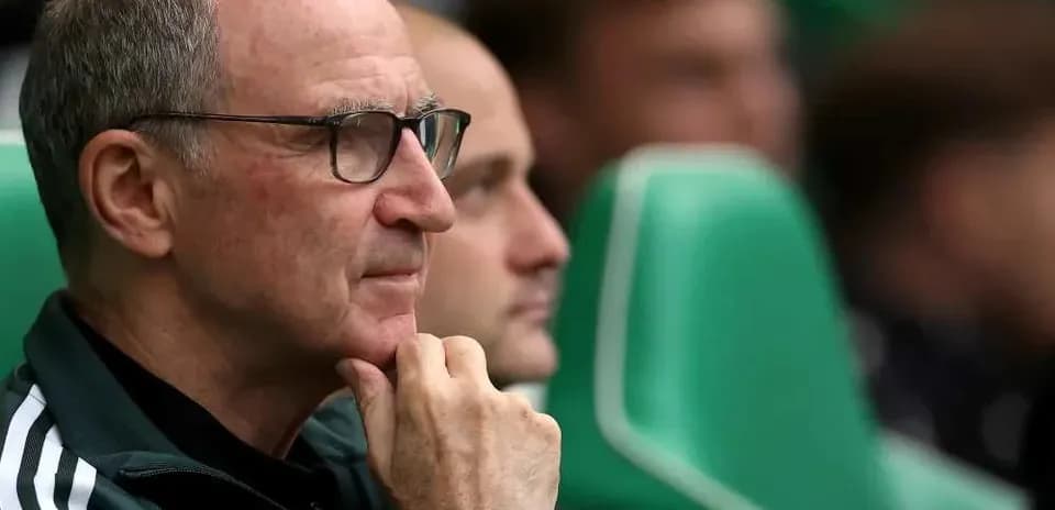 Coach observing match from the sidelines