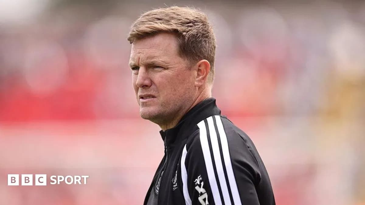 Coach observing during a match on the sidelines