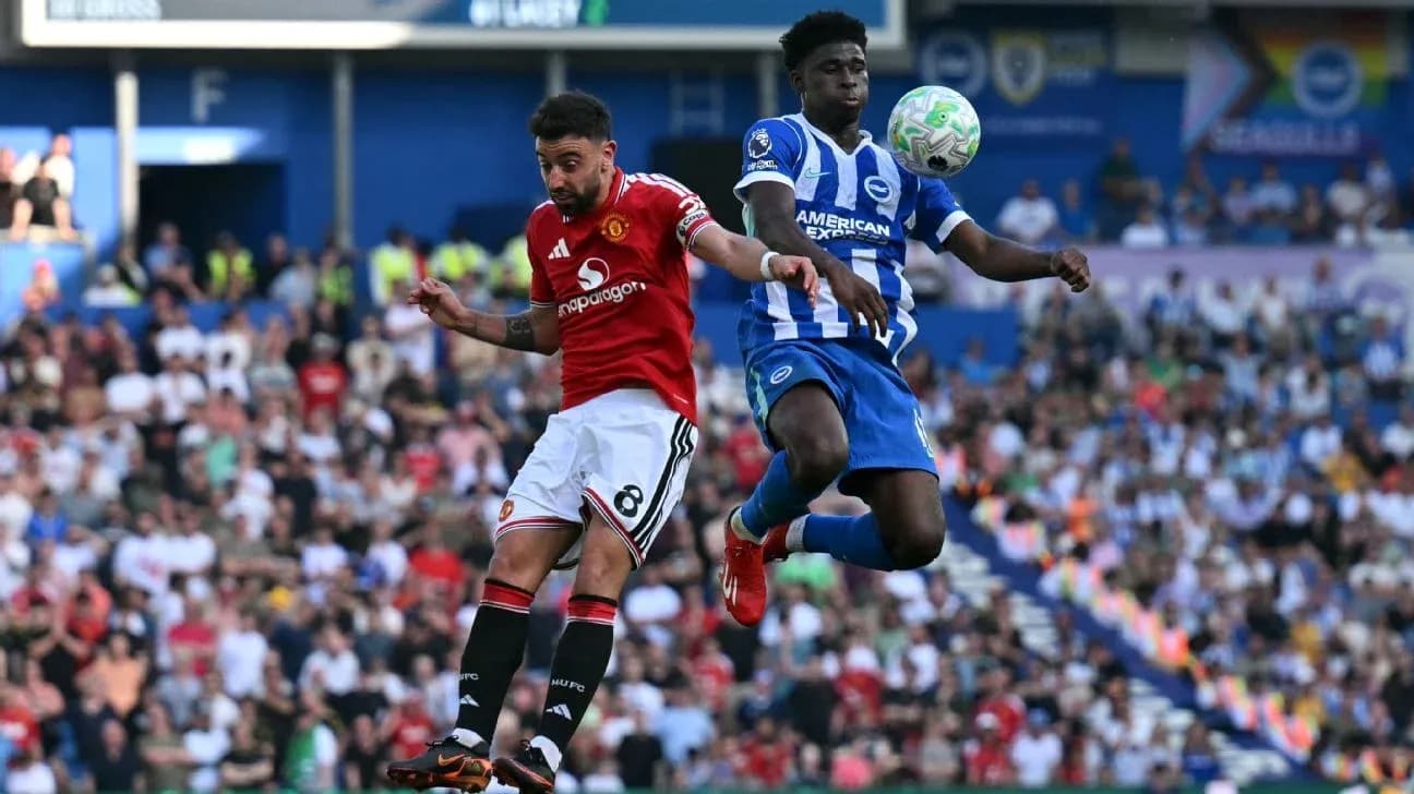 Player from Manchester United challenges Brighton player for ball