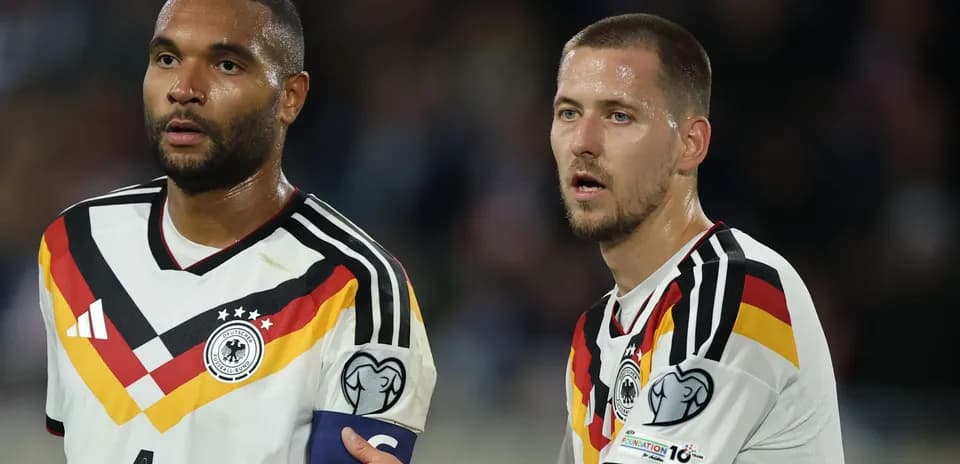 Two German players discussing during match
