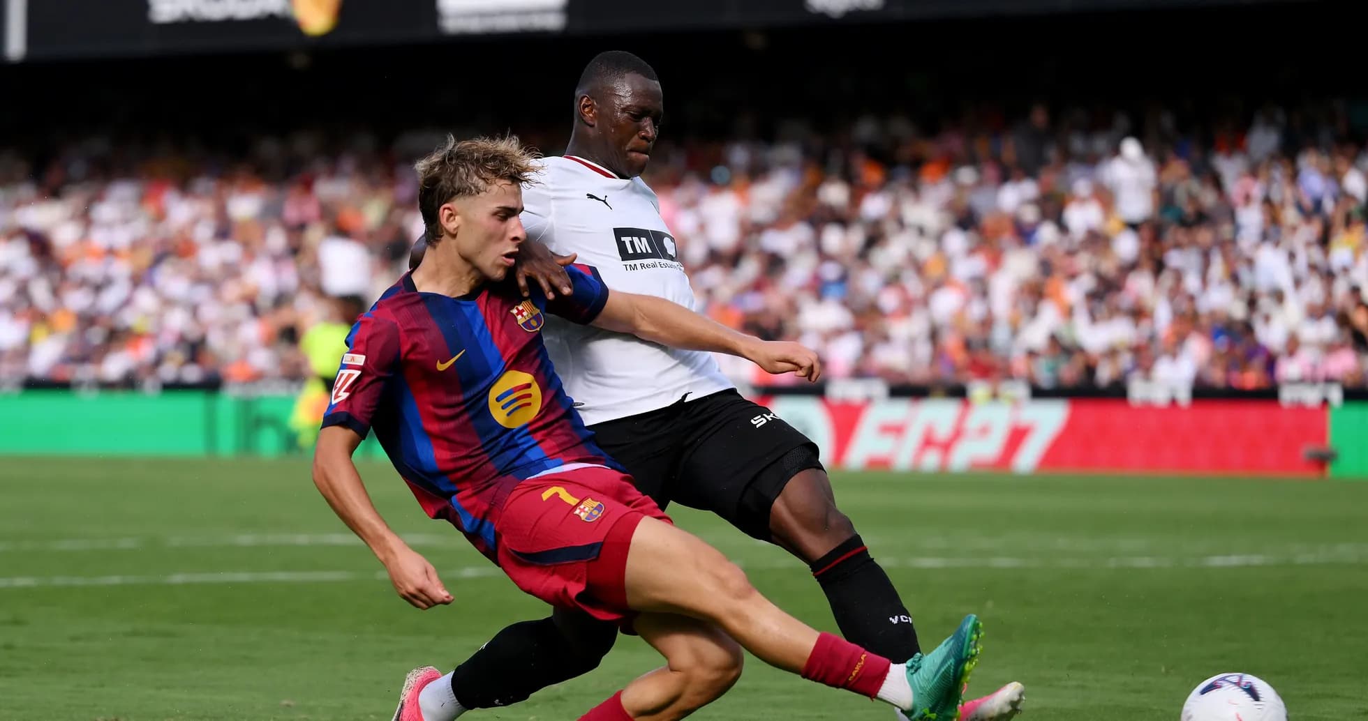 Player tackling opponent during a football match