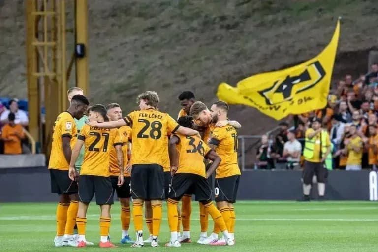 Wolverhampton players huddled before a match