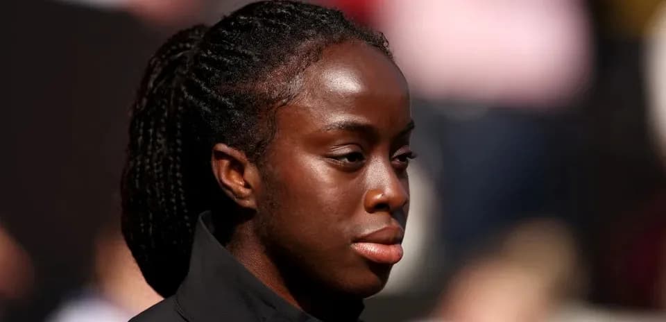 Athlete in black jacket during outdoor event