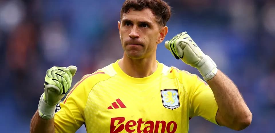 Goalkeeper celebrating with clenched fist in uniform