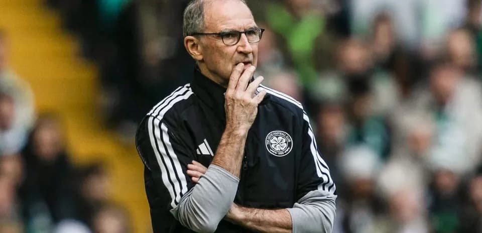 Coach observing the match with arms crossed