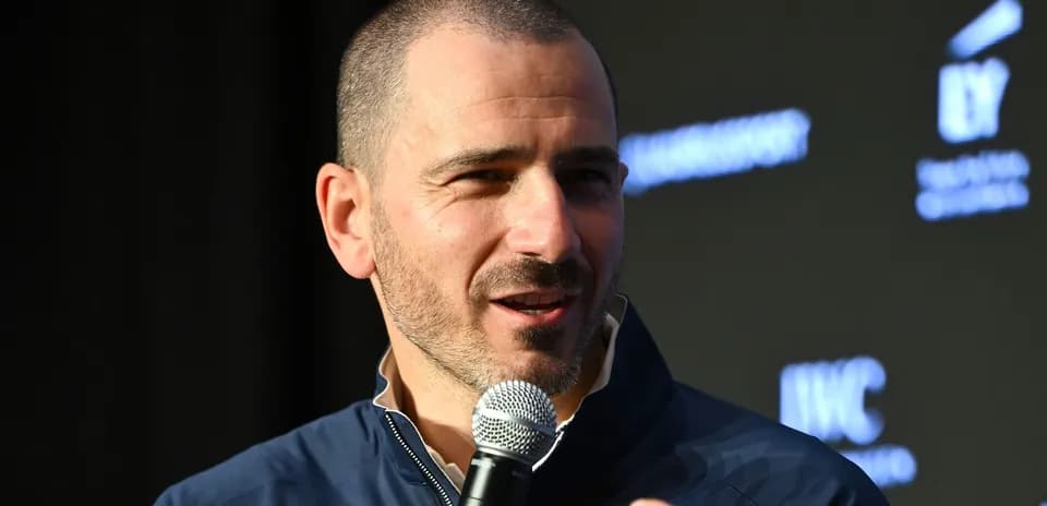 Person speaking into a microphone at event