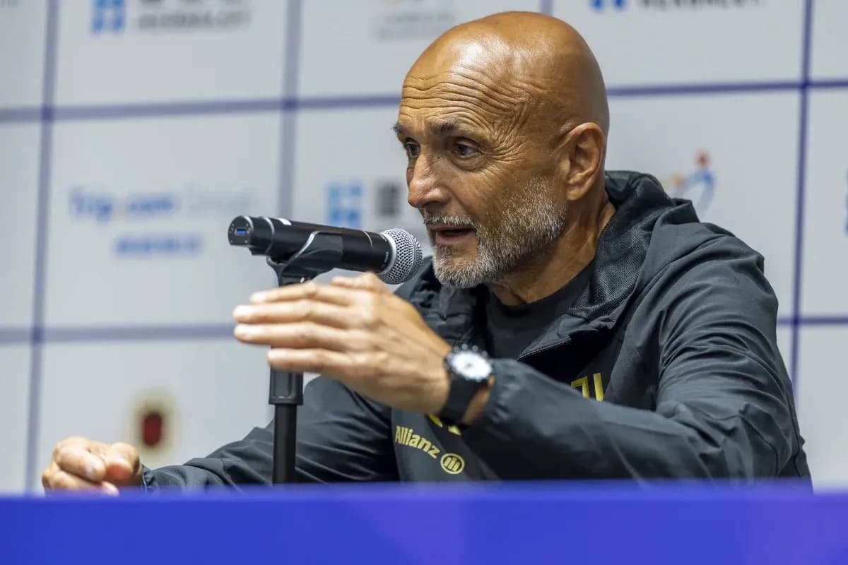 Manager speaking at press conference with microphone