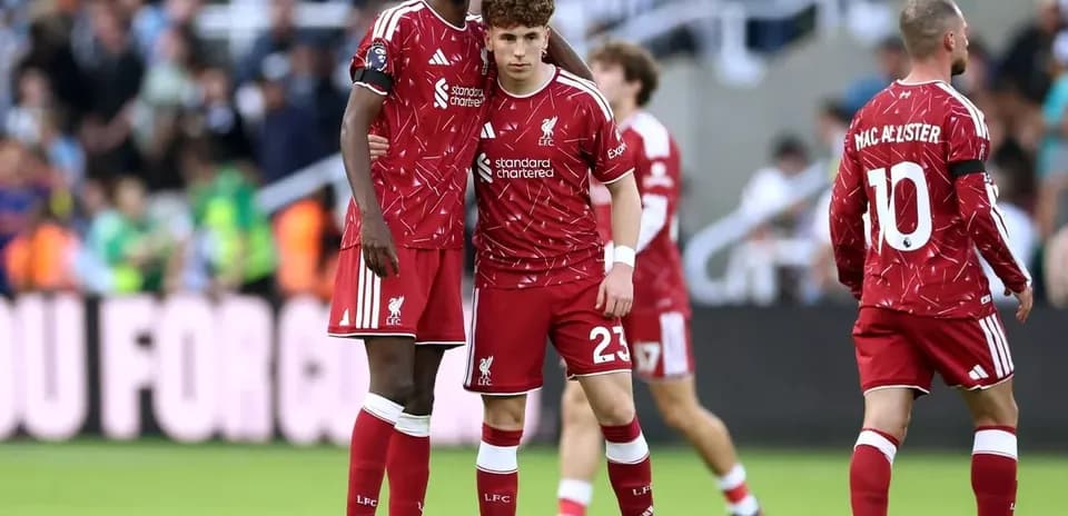Liverpool players discussing during a match
