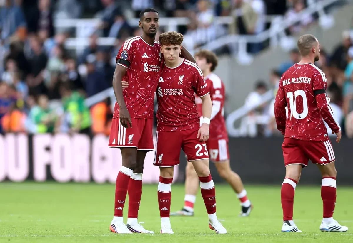 Liverpool players discussing during a match