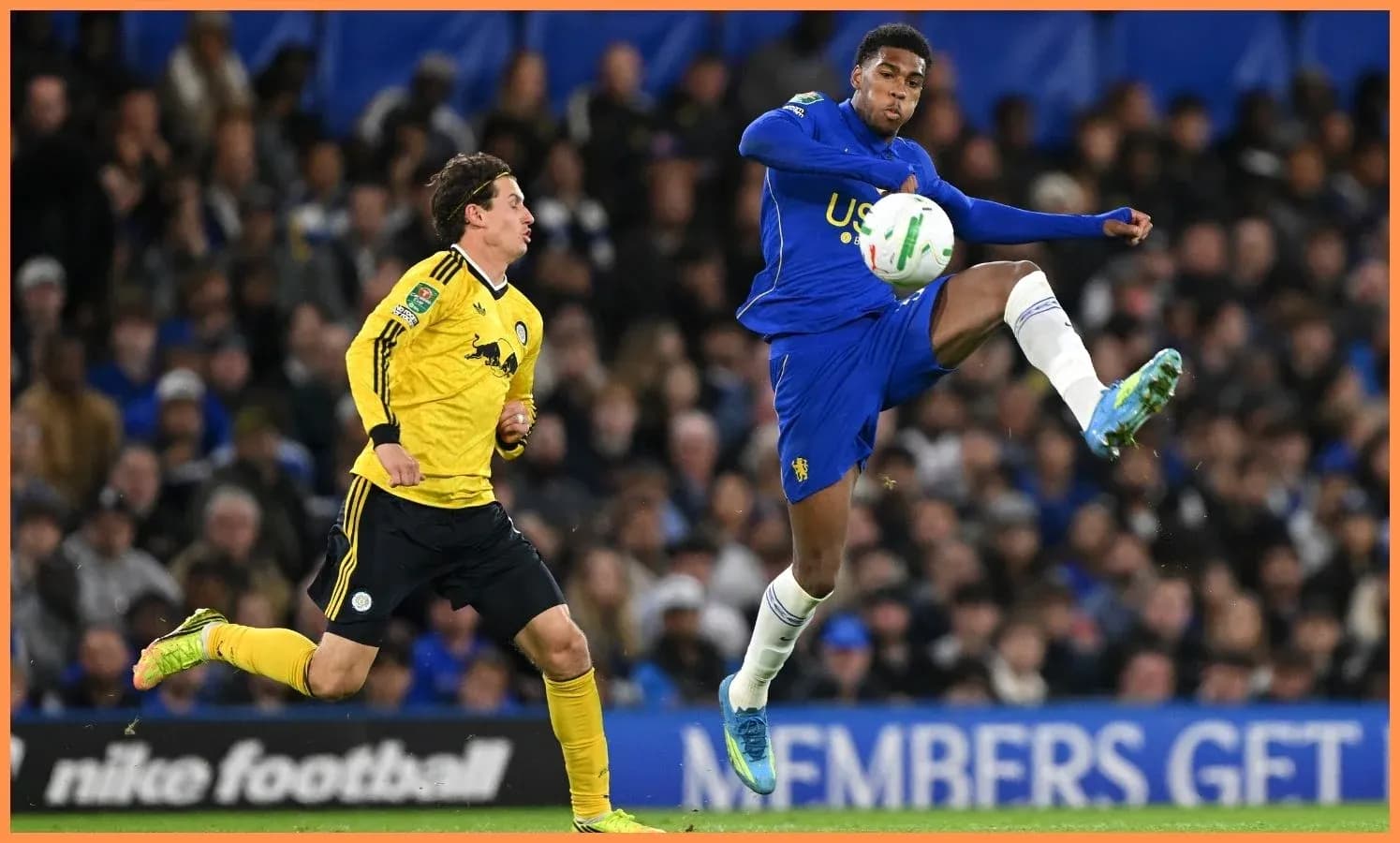 Player kicking the ball during football match
