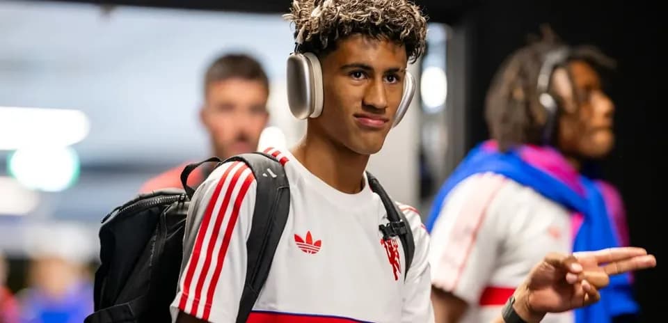 Player wearing headphones walking in hallway