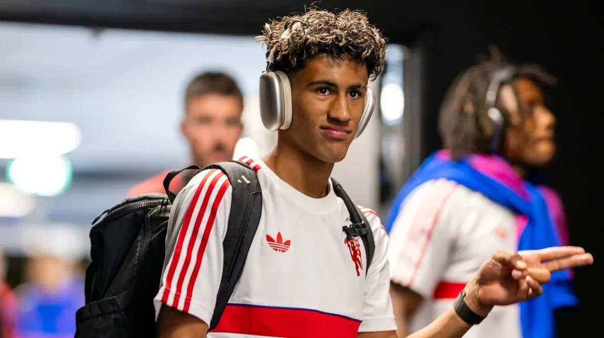 Player wearing headphones walking in hallway
