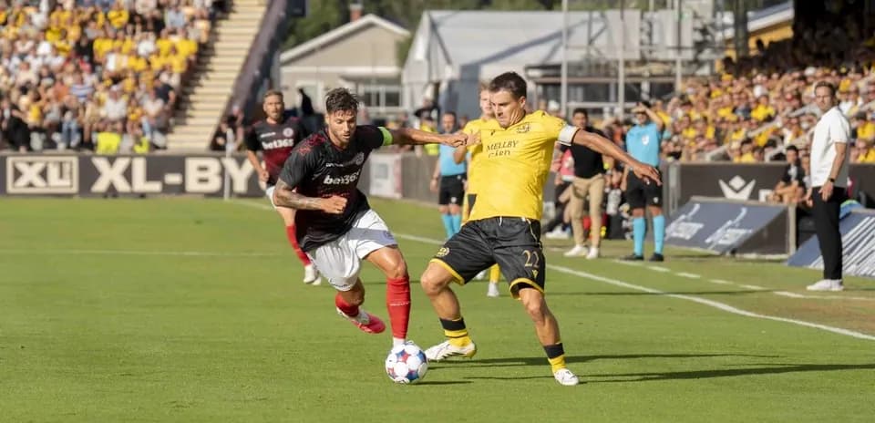 Players competing for the ball during match