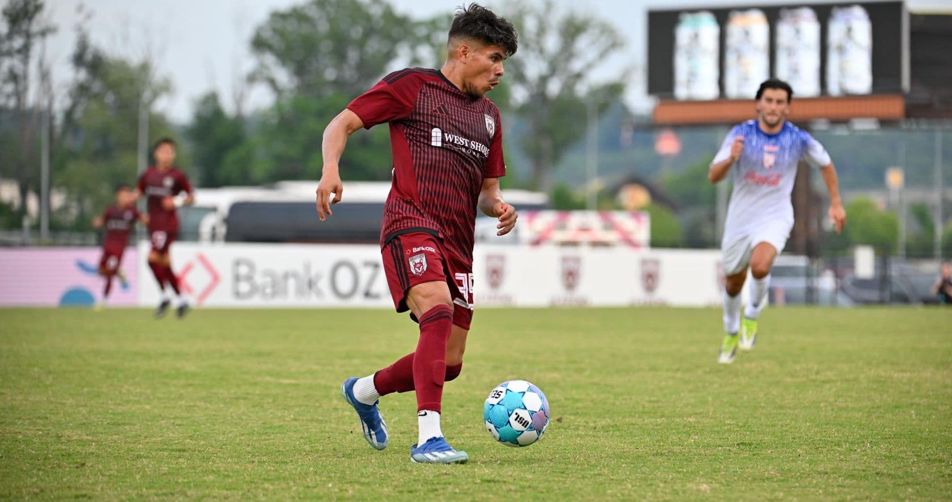 Player dribbling ball during Knoxville vs Chattanooga match