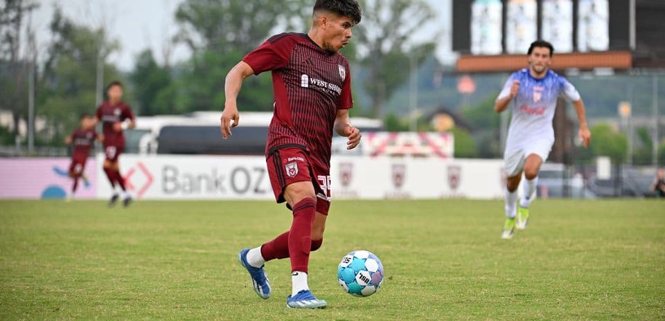 Player dribbling ball during Knoxville vs Chattanooga match