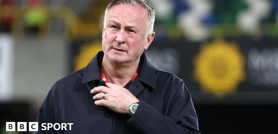 Manager looking thoughtful during a match