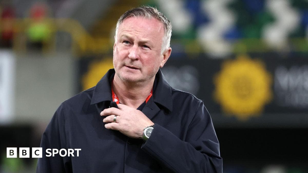 Manager looking thoughtful during a match