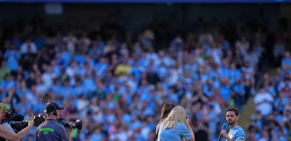 Bernardo Silva speaking to fans at stadium event