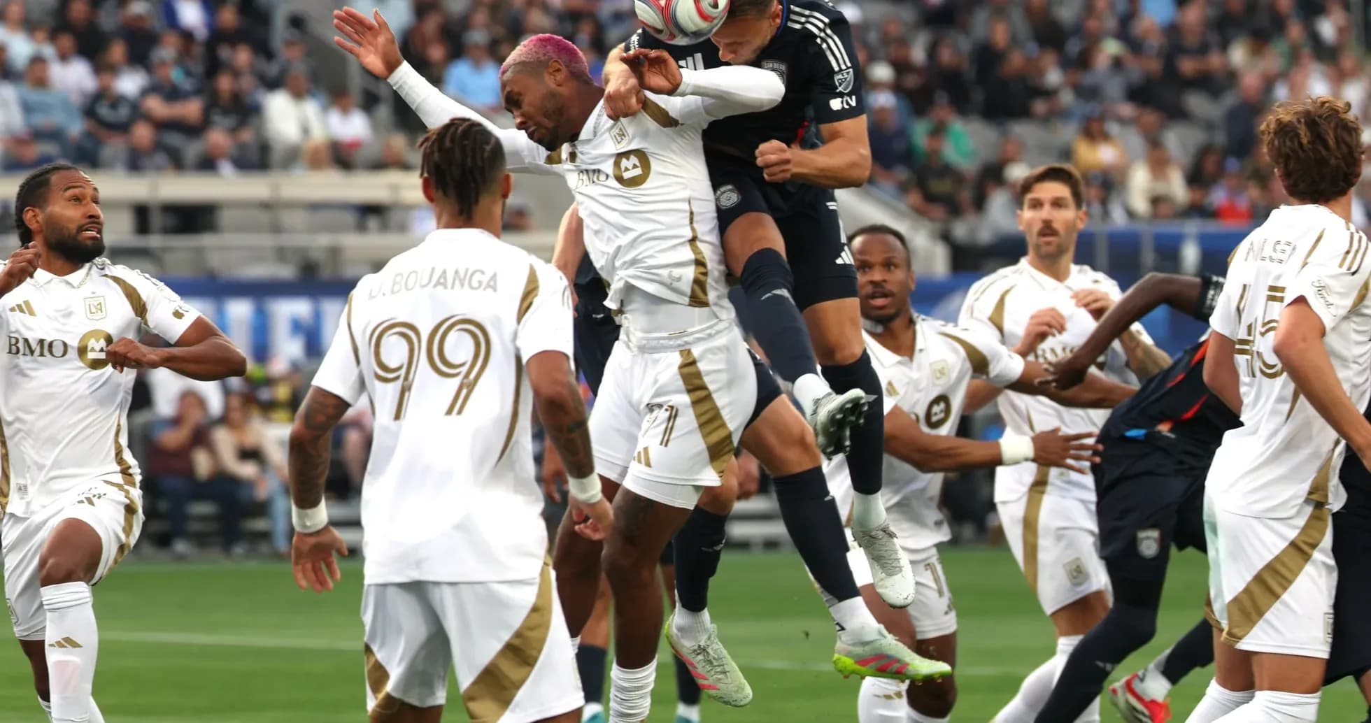 Players competing for the ball in MLS match